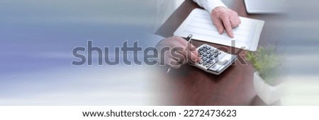 Male hands using calculator. concept of finance and economy; panoramic banner