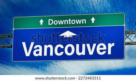Road sign indicating direction to the city of Vancouver.