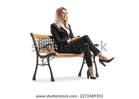 Young professional woman sitting on a bench isolated on white background