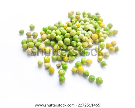 picture of frozen green peas melting on white background.Half ripe green pea.