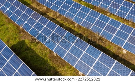 Aerial view of a large solar panel installation for converting solar energy into electricity. Solar energy accumulators. Green economy concept.