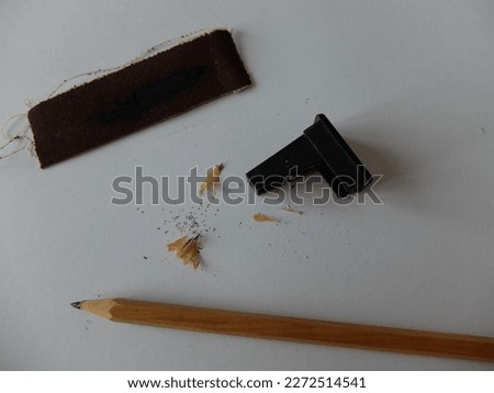 sharpening a pencil with a pencil sharpener. drawing supplies