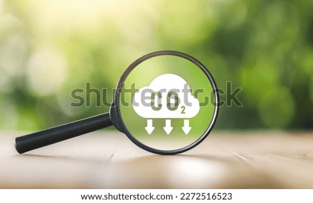 CO2 emission concept. Green industries business concept. Net zero emissions. Magnifying glass with Co2 symbol. Concepts Net Zero Emissions Goals A climate-neutral. Renewable energy. ecology solutions. Royalty-Free Stock Photo #2272516523