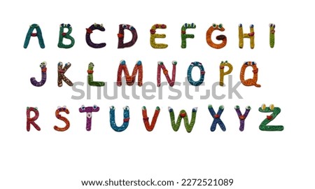 Alphabet on a white background. Funny letters from salt dough. Handmade letters.