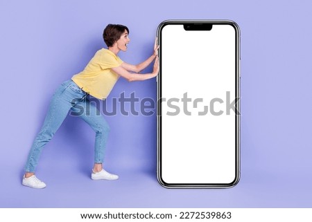 Full length portrait of cheerful pretty person arms push huge empty space ui panel isolated on purple color background