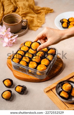 Nastar cookies or Pineapple tart is a small, bite-size pastry filled or topped with pineapple jam, commonly found throughout different parts of Southeast Asia such as Indonesia (kue nastar) Royalty-Free Stock Photo #2272552529