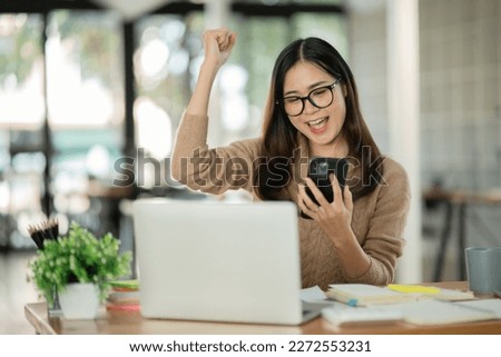 Asian woman making a happy face