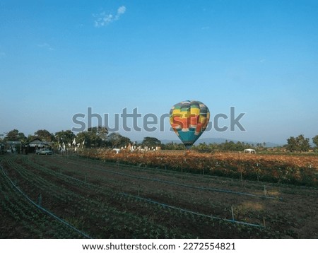 Balloon floating sunrise colorful rainbow blue sky background copy space outdoor garden natural mountain view tourism travel journey vacation holiday freedom summer spring season tour valley beautiful