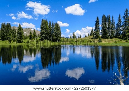 Clouds Reflecting on Wheeler Lakes on Gore Range Trail near Copper, Colorado, USA. Royalty-Free Stock Photo #2272601377