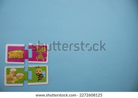 Animal picture puzzles are animal picture puzzles with pictures of mouse, cheese, honey bee and honey placed on the left over blue background.