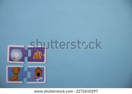 Animal picture puzzles are animal picture puzzles with pictures of fish, bell jar, hut and dog placed on the left over a blue background.