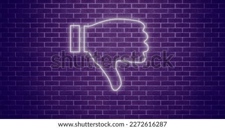 Composition of white neon outline thumbs down icon over purple background. Global social media, networks and communication concept digitally generated image.