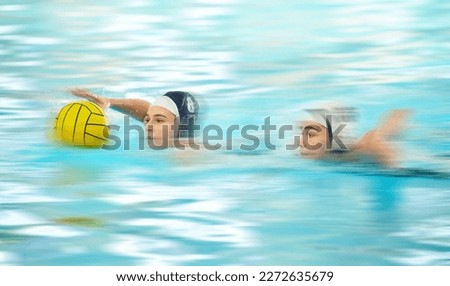 Water sports, polo and athlete swimming with a ball for a competition, exercise or hobby. Fitness, blur motion and female swimmer training to play a professional sport game or match in a indoor pool.