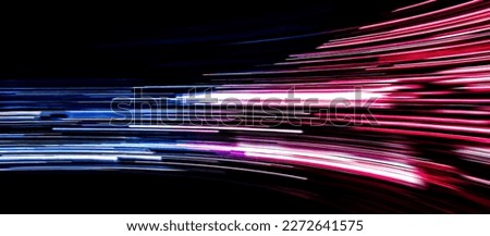 speed light line motion blur on dark background, data transfer simulation, blue to red lights Royalty-Free Stock Photo #2272641575