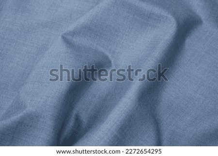 Plain silver grey blue fabric cloth texture. Abstract background of monochromatic textile material and texture for design. Close-up. Copy space. Royalty-Free Stock Photo #2272654295