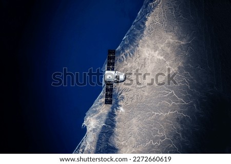 Spaceship in flight over the Earth. Elements of this image furnishing NASA. High quality photo