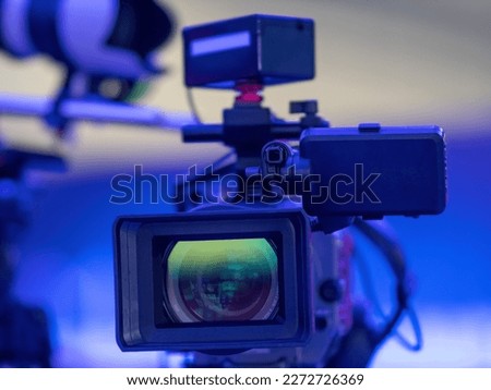 Professional Broadcast Camera Lens on Set Background Royalty-Free Stock Photo #2272726369