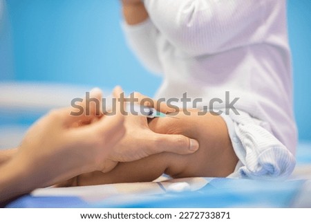 pediatrician Hand hold vaccine liquid injection in syringe for injecting child baby infant. small syringe needle for infant prevention flu by vaccination immunity in Pediatrics hospital clinic. Royalty-Free Stock Photo #2272733871