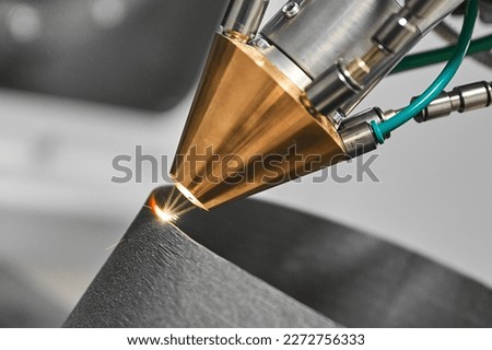 3d printer makes mechanical detail with metal powder in shop Royalty-Free Stock Photo #2272756333