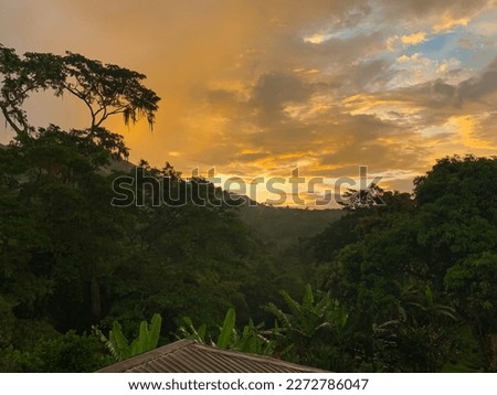 Sunset hiding in the mountains Royalty-Free Stock Photo #2272786047