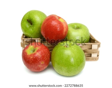 Green Apple in basket on white background