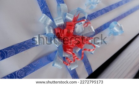 Red and blue ribbon decoration for gift wrapping.Birthday.Artwork.