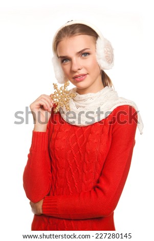 Mode in the red dress holding golden shiny snowflake trinket isolated on white