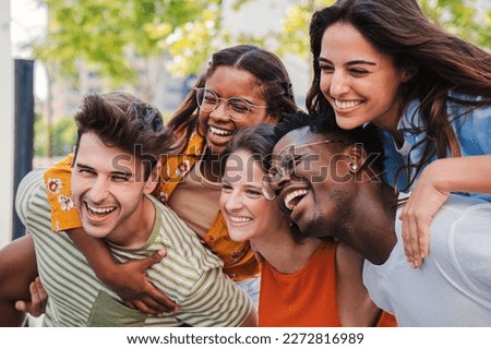 Close up portrait of a group of smiling multiracial teenage friends having fun outdoors. Cherful young people laughing together on vacation. Lifestyle concept. High quality photo Royalty-Free Stock Photo #2272816989