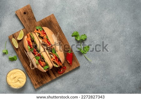 Banh mi, vietnamese sandwich. Top view, flat lay, copy space, selective focus. Royalty-Free Stock Photo #2272827343