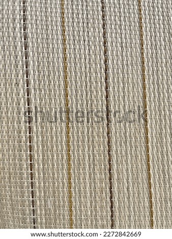 Brown and gray woven background. Knitted fabric surface.Bamboo knitted fabric surface.