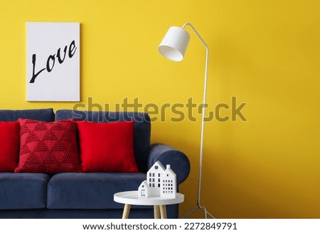 Interior of living room with blue sofa and table Royalty-Free Stock Photo #2272849791