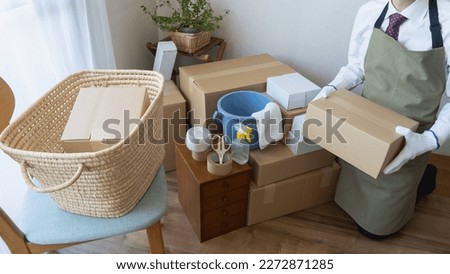 An image of a businessman moving house.
