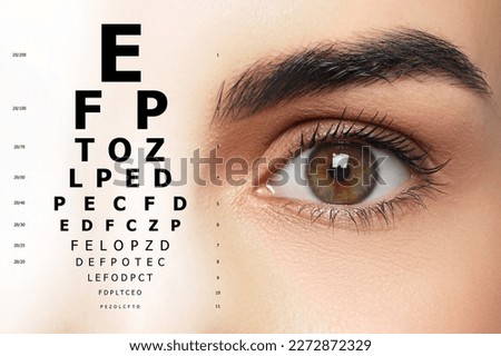 Vision test. Woman and eye chart on white background Royalty-Free Stock Photo #2272872329
