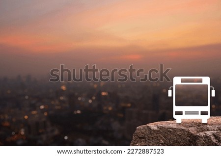 Bus icon on rock mountain over blur of cityscape on warm light sundown, Business transportation service concept