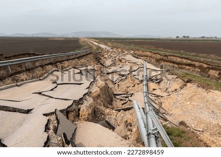 In the 7.7 magnitude earthquake that took place in Kahramanmaraş, the village road in Gaziantep's Nurdağı district was damaged due to the earthquake. Royalty-Free Stock Photo #2272898459