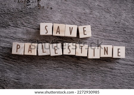 
wooden block inscription "save palestine"