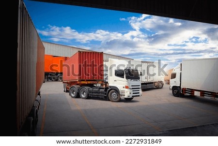 Semi Trailer Trucks on The Parking Lot. Trucks Loading at Dock Warehouse. Shipping Cargo Container Delivery Trucks. Distribution Warehouse. Freight Trucks Cargo Transport. Warehouse Logistics. Royalty-Free Stock Photo #2272931849