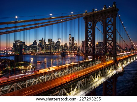 New York City - beautiful sunset over manhattan with manhattan and brooklyn bridge Royalty-Free Stock Photo #227293255