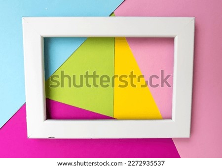 White wooden frame on colorful  background with copy space for text  . 
