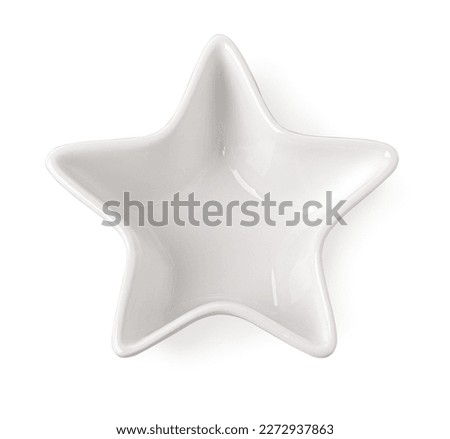 Empty star shape ceramics plate isolated on white background with clipping path. Royalty-Free Stock Photo #2272937863