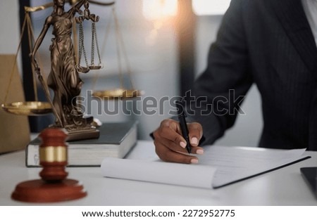 Lawyer woman hands working at office desk, concepts of law and legal services, law contract.