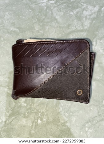 Photo of an old brown wallet
