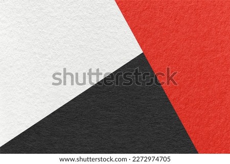 Texture of craft white, red and black shade color paper background, macro. Structure of vintage abstract cardboard with geometric shape and gradient. Felt backdrop closeup.