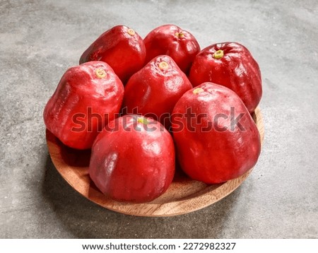 Syzygium malaccense or jambu bol. Syzygium malaccense is a species of flowering tree native to Malesia and Australia. It is known as a Malay rose apple, or simply Malay apple.