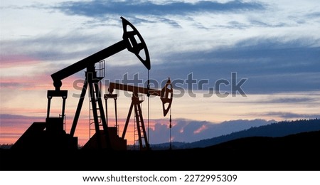 The change in oil prices caused by the war. Oil price cap concept. Oil drilling derricks at desert oilfield. Crude oil production from the ground. Petroleum production. Royalty-Free Stock Photo #2272995309