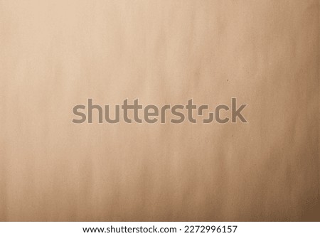Cardboard texture, beige paper, design background, copy space. Recyclable material, has flecks of pulp.