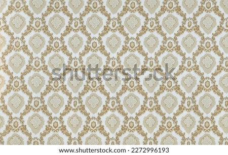 Old wallpaper on the wall. Old wallpaper for texture or background. Royalty-Free Stock Photo #2272996193