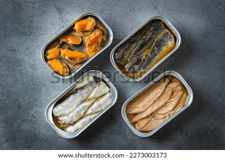 Assortment of Tinned fish, canned food ready for date night Royalty-Free Stock Photo #2273003173