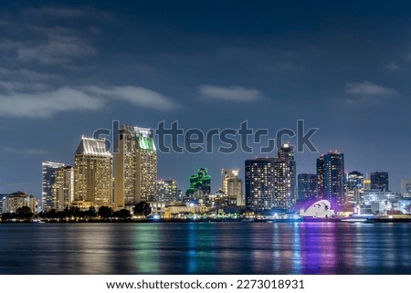 San Diego skyline at night with water colorful reflections, view from Coronado island, California