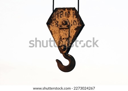 Big old rusty hook from a construction crane.